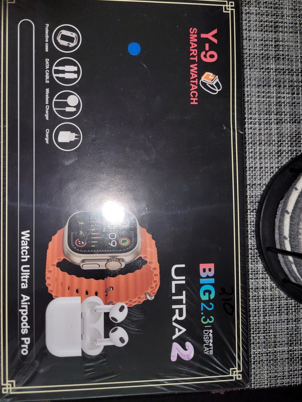 Y-9 Smartwatch with Orange Strap and White Earbuds